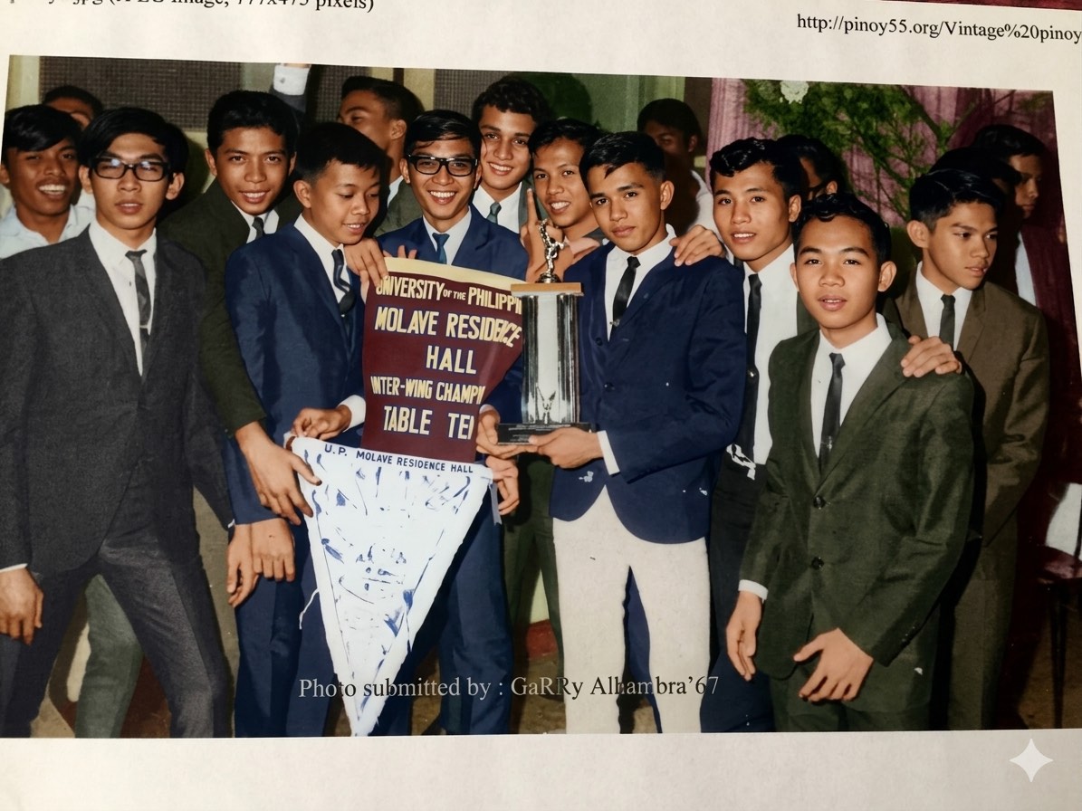 UPBF 55 members holding a championship trophy and residence hall banner in a historic indoor photo.